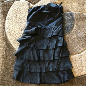 Short black ruffled strapless dress